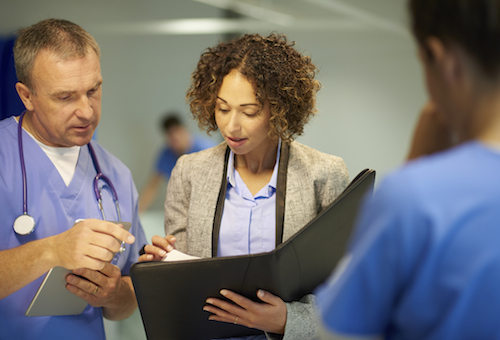 Medical personnel reviewing a chart